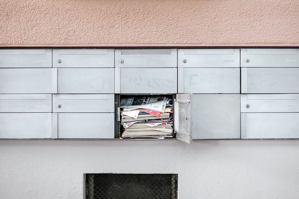 Overflowing mailbox, metaphor for the need for AI email management to enhance productivity.